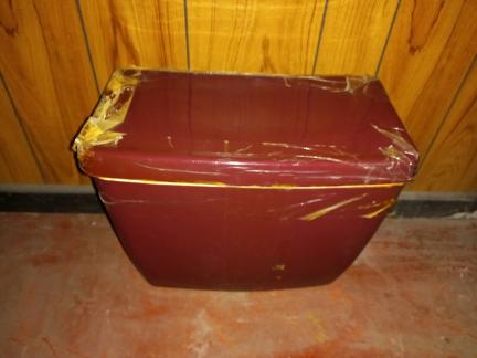 low level burgundy toilet cistern tank