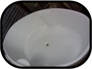 large oval build in tile in bath thin rim