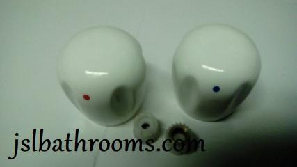 white ceramic tap heads blue red dots