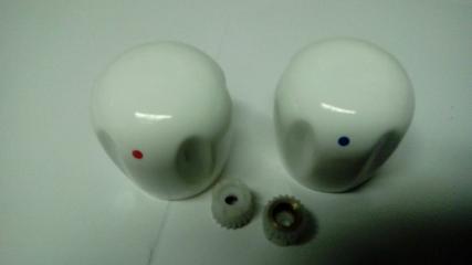 white ceramic tap heads blue red dots